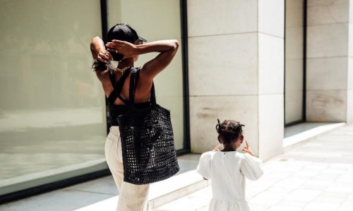 The essence of exceptional living a woman walking with her child