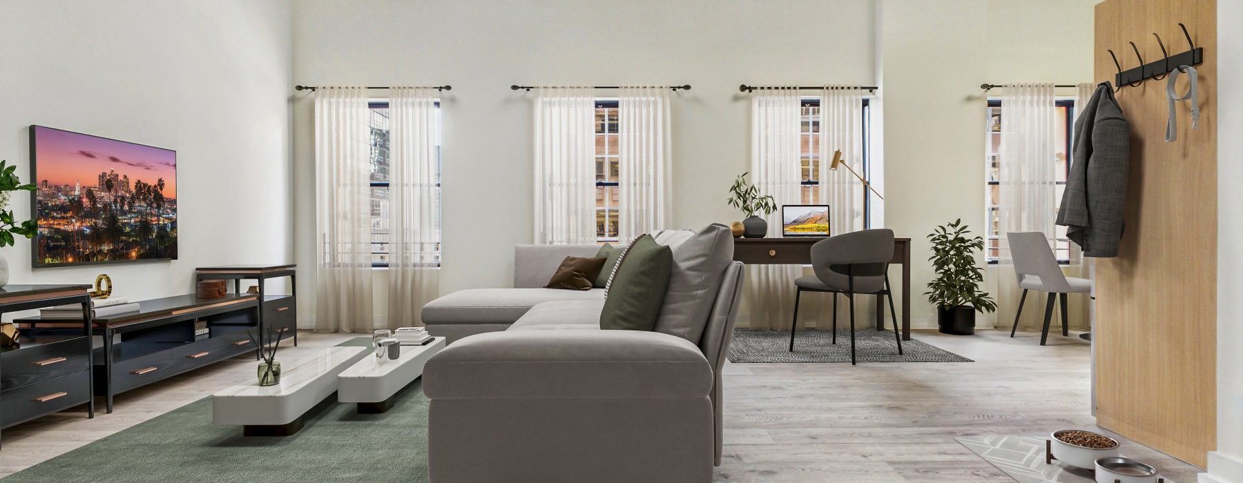a living room with couch and desk