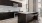 a kitchen with black cabinets