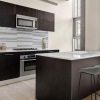 a kitchen with black cabinets